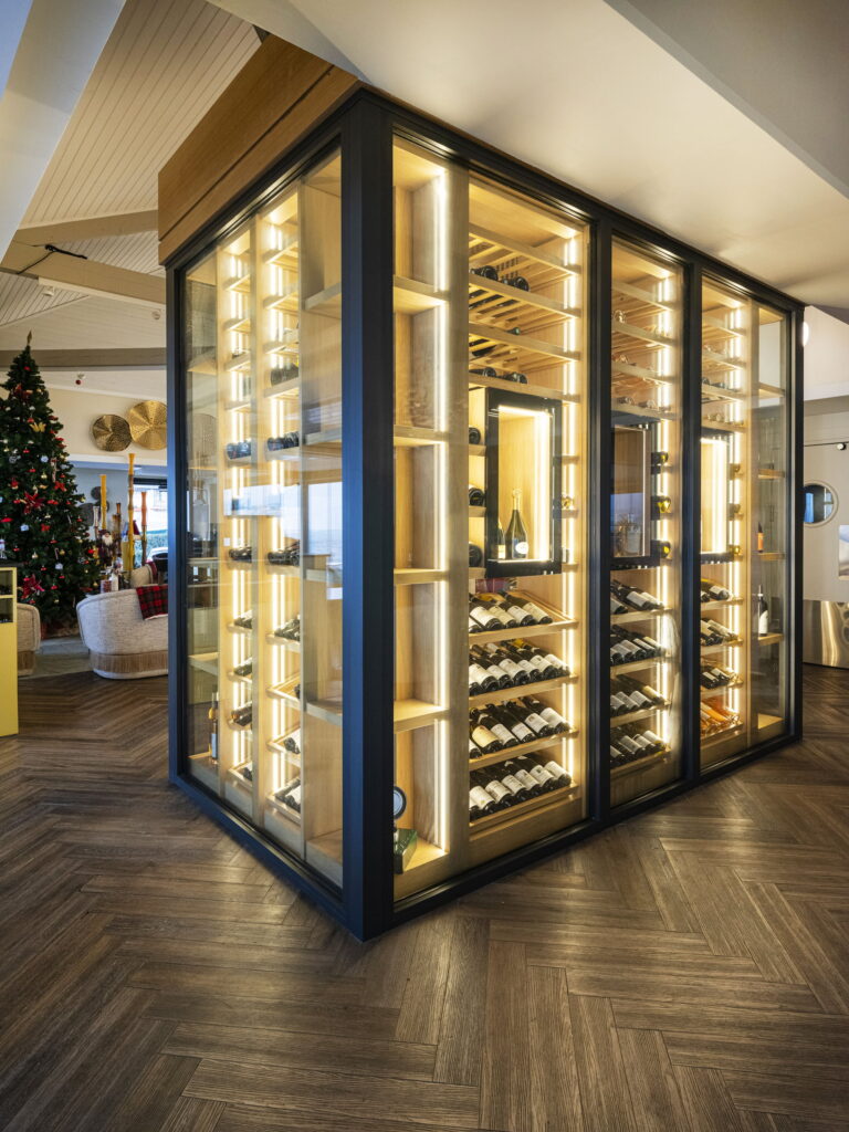 Bespoke restaurant furniture wine cellar with lighting