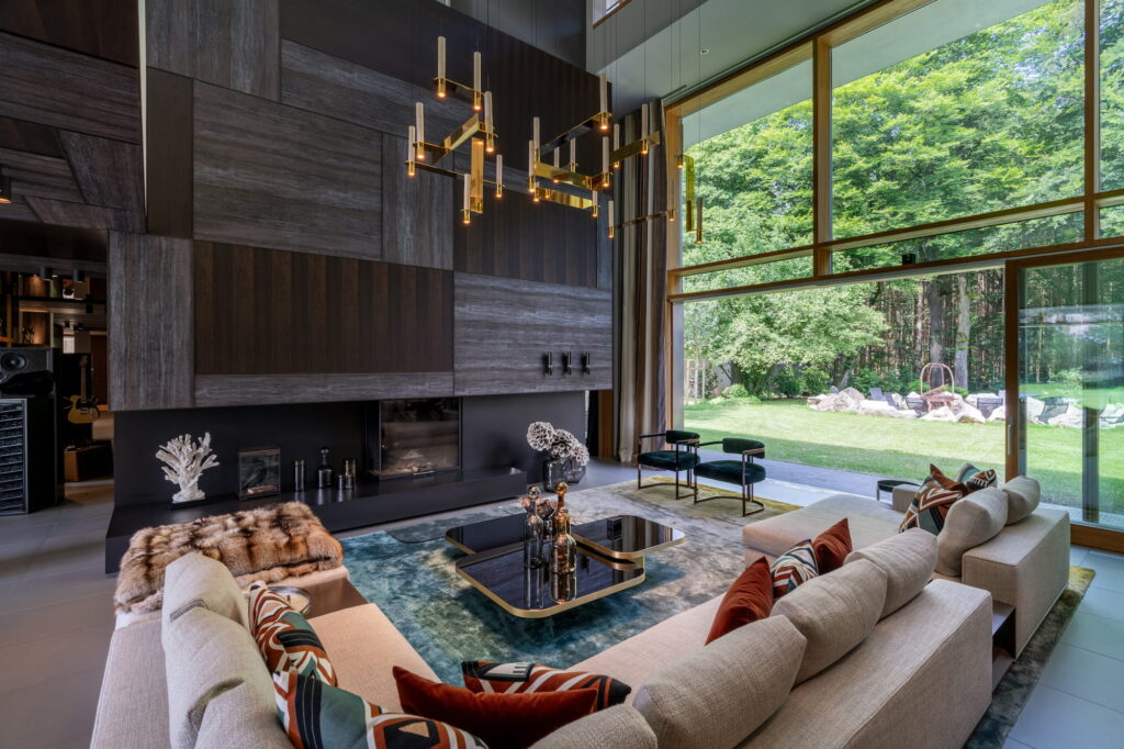 Custom stained oak wall paneling and integrated fireplace in Villa